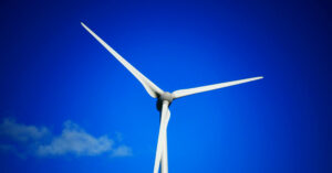 Wind turbine symbolizing renewable energy and corporate sustainability.